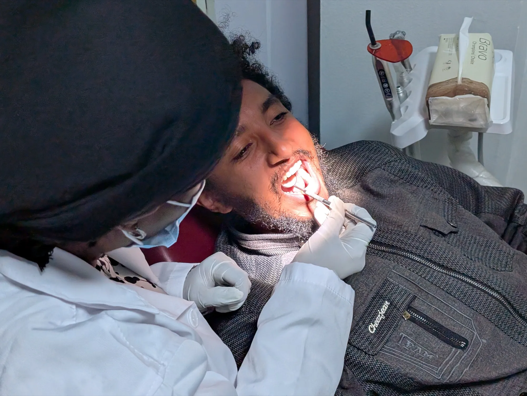 A dentist examining a patient at Makrose Speciality Dental Clinic